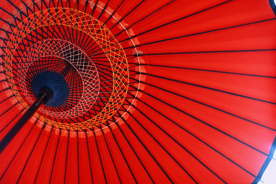 the underside of a bold red umbrella
