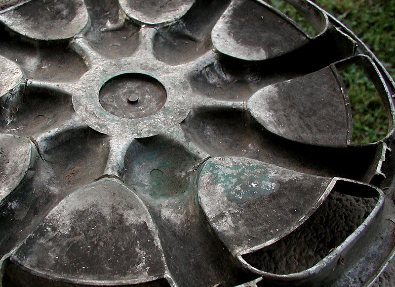 dirty spokes of a hubcap