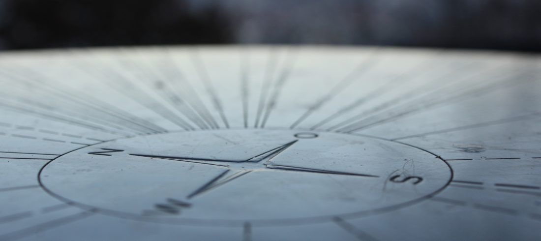 compass etched into stone